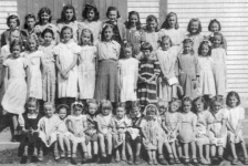 512: Group of 39 young ladies. (circa 1950) [courtesy of Lorna Richardson] ** also see 511 &amp;amp; 513 **  Standing in back row (top step) left-to-right, Imelda Ryan, Annie Norman, Marg Norman,  Marie Ryan, Angela Ryan, Gwen Carroll, Marie Counsel, Teresa Whelan, Beth Lambe, Kathleen Barry,  Teresa Norman; standing in second row from back (second step), Madonna McCarthy, Babe Ennis,  Mary Finn, Noreen Ryan, Mary Ennis, Madonna Whelan, Kathleen Lambe, unidentified,  Gert Ryan, Teresa Kerrivan, Lorraine Kerrivan, Anne Counsel; standing on first step, Mary Reddy;  sitting on first step left-to-right, ? Ennis, unidentified, Sheila Ryan (wearing bonnet),  unidentified (with white bow), unidentified, ? Ennis, Irene Webber, unidentified (dark dress),  unidentified (wearing white head covering), unidentified, Hilda Whelan, unidentified,  Rita Whelan, unidentified, Bernardine Whelan. ** more details below **  - Kathleen Barry (of Thomas Barry &amp;amp; Anne Dollimont)  - Gwen Carroll (of Michael Carroll &amp;amp; Josephine Barry)  - Anne Counsel (of Michael Counsel &amp;amp; Mary Anne Barry)  - Marie Counsel (of Michael Counsel &amp;amp; Mary Anne Barry)  - Babe Ennis (of Vincent Ennis &amp;amp; Mary Carroll)  - Mary Ennis (of Vincent Ennis &amp;amp; Mary Carroll)  - Mary Finn (of Patrick Finn &amp;amp; Helena Hayward)  - Lorraine Kerrivan (of James Kerrivan &amp;amp; Josephine Norman)  - Teresa Kerrivan (of Peter Kerrivan &amp;amp; Cecilia Cheeseman)  - Beth Lambe (of James Lambe &amp;amp; Catherine Rodgers)  - Kathleen Lambe (of James Lambe &amp;amp; Catherine Rodgers)  - Madonna McCarthy (of James McCarthy &amp;amp; Mary Ellen Barry)  - Annie Norman (of John Norman &amp;amp; Mary Farget)  - Marg Norman (of Charles Norman &amp;amp; Elizabeth Anne Barry)  - Teresa Norman (of Peter Norman &amp;amp; Margaret Norman)  - Mary Reddy (of Michael Reddy &amp;amp; Elizabeth Moore)  - Angela Ryan (of Michael Ryan &amp;amp; Petronella Whelan)  - Gert Ryan (of Jeremiah Ryan &amp;amp; Josephine Lambe)  - Imelda Ryan (of Jeremiah Ryan &amp;amp; Josephine Lambe)  - Marie Ryan (of Joseph Ryan &amp;amp; Ursula Barry)  - Noreen Ryan (of Albert Ryan &amp;amp; Catherine Nolan)  - Sheila Ryan (of Albert Ryan &amp;amp; Catherine Nolan)  - Irene Webber (of William Webber &amp;amp; Anne Counsel)  - Bernardine Whelan (of Leo Whelan &amp;amp; Elizabeth Bishop)  - Hilda Whelan (of Leo Whelan &amp;amp; Elizabeth Bishop)  - Madonna Whelan (of Leo Whelan &amp;amp; Elizabeth Bishop)  - Rita Whelan (of Leo Whelan &amp;amp; Elizabeth Bishop)  - Teresa Whelan (of Leo Whelan &amp;amp; Elizabeth Bishop)